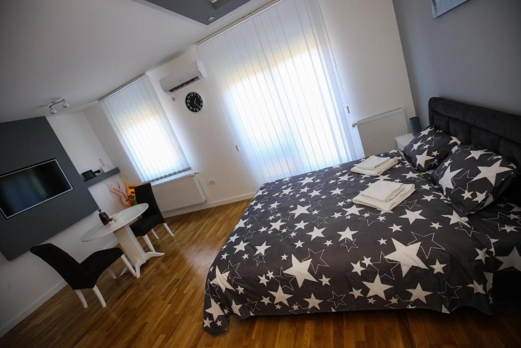 Postel nebo postele na pokoji v ubytování MANIROSI 3 apartman