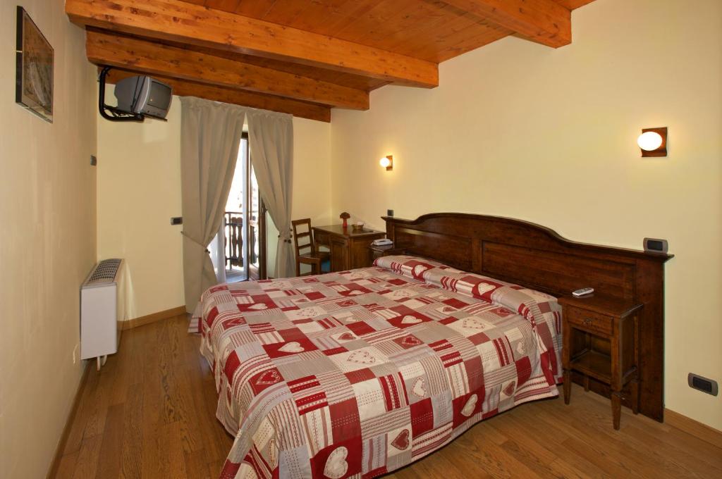 Postel nebo postele na pokoji v ubytování Hotel Chez Toi
