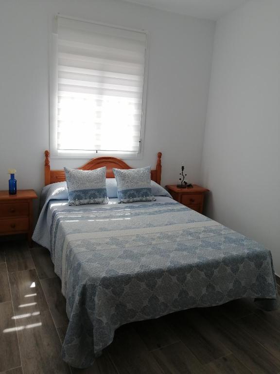 Postel nebo postele na pokoji v ubytování Urb Rivera guadiaro 6 Casa Marta