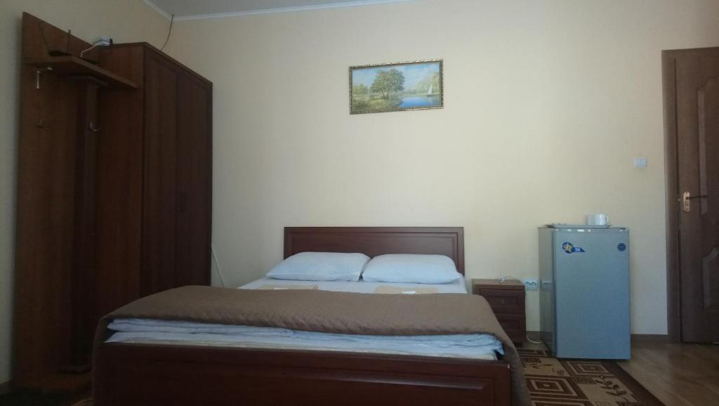 Postel nebo postele na pokoji v ubytování Садиба у Яноша