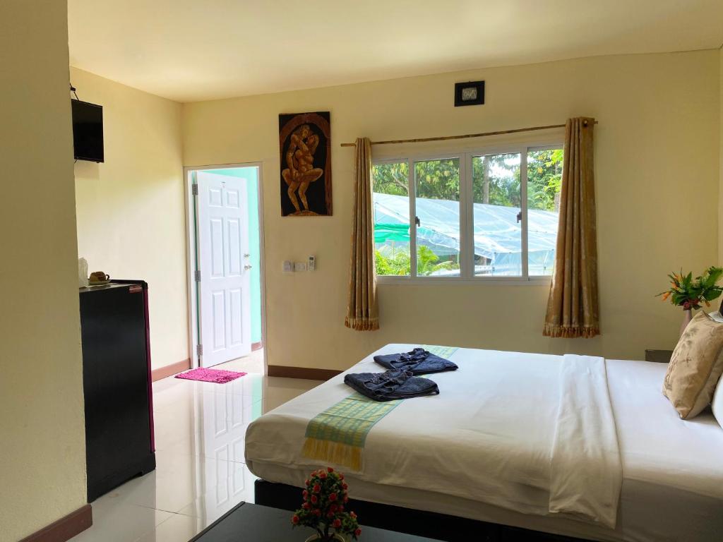 Postel nebo postele na pokoji v ubytování Everest Resort Samui - SHA Plus