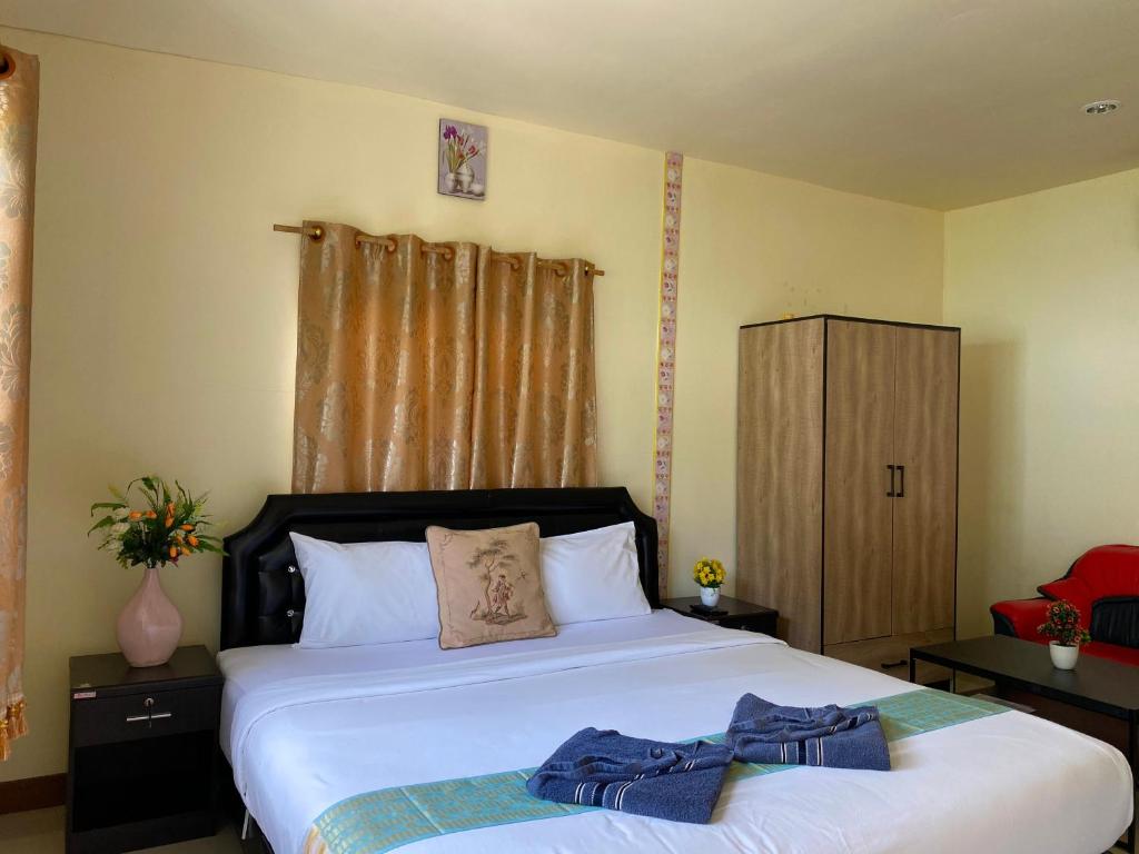 Postel nebo postele na pokoji v ubytování Everest Resort Samui - SHA Plus