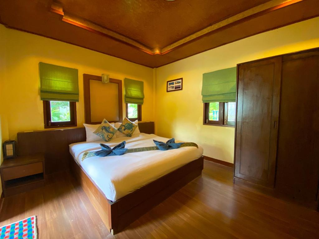 Postel nebo postele na pokoji v ubytování Everest Resort Samui - SHA Plus