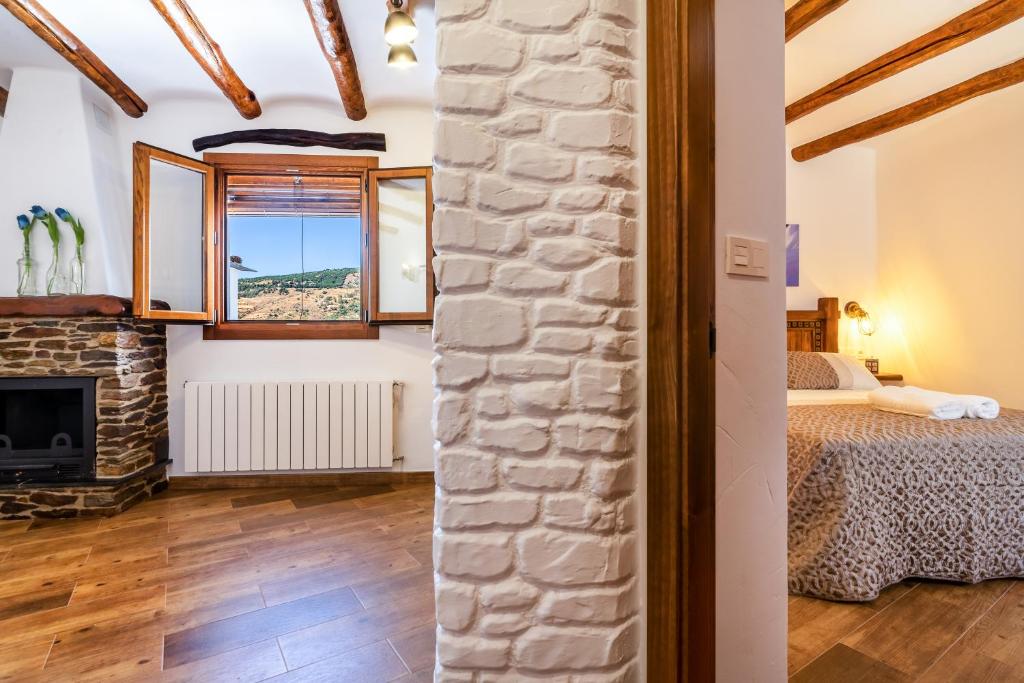 Posteľ alebo postele v izbe v ubytovaní Apartamentos Entre Senderos