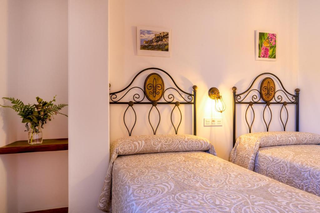 Posteľ alebo postele v izbe v ubytovaní Apartamentos Entre Senderos