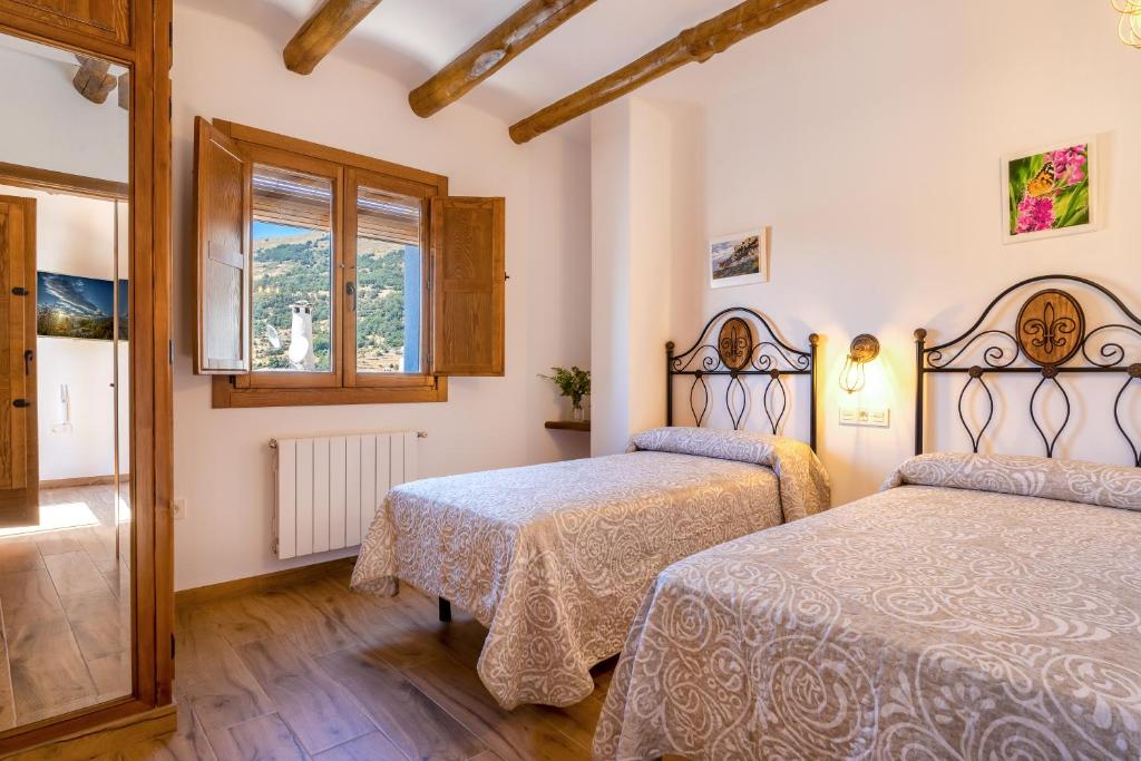 Posteľ alebo postele v izbe v ubytovaní Apartamentos Entre Senderos