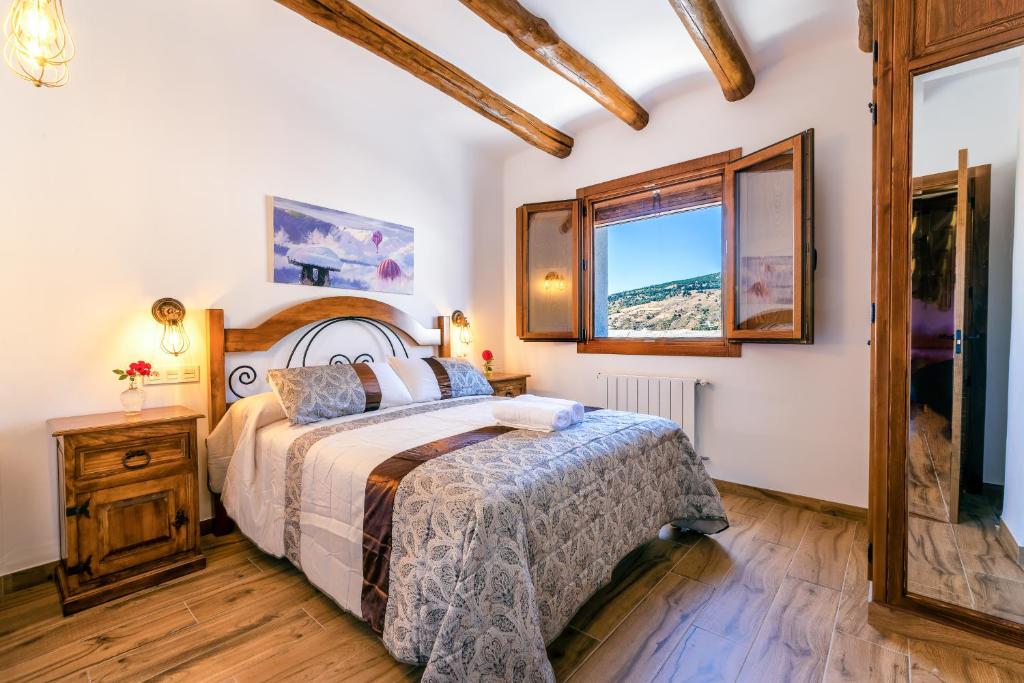 Posteľ alebo postele v izbe v ubytovaní Apartamentos Entre Senderos