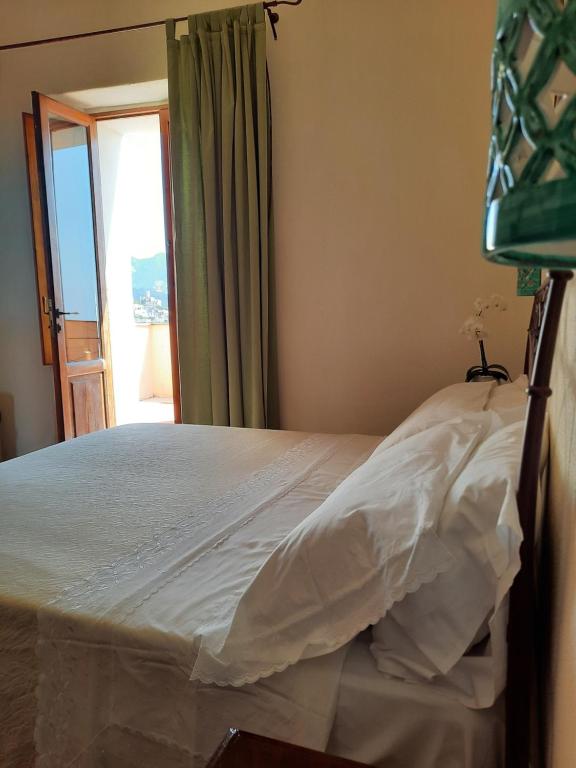 Postel nebo postele na pokoji v ubytování Portico Del Paradiso