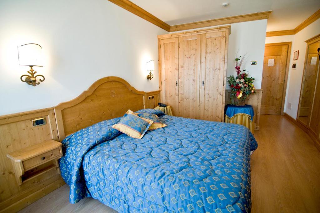 Postel nebo postele na pokoji v ubytování Albergo Valbella
