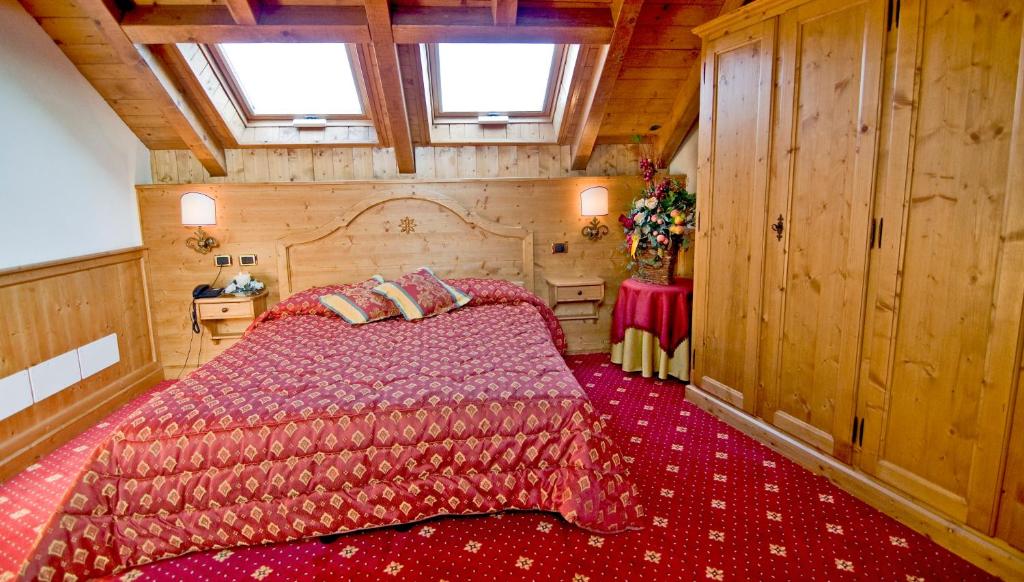 Postel nebo postele na pokoji v ubytování Albergo Valbella