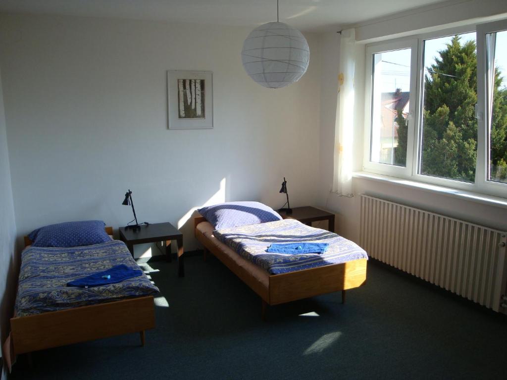 Postel nebo postele na pokoji v ubytování Apartmán Wolkrovka