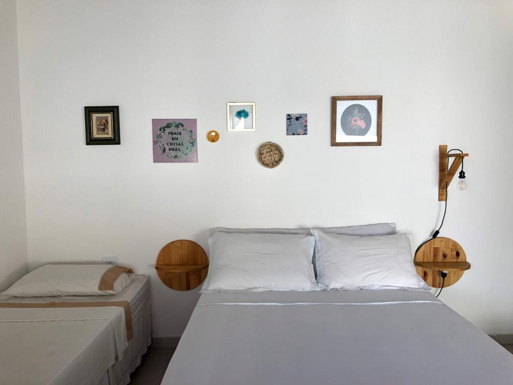 Säng eller sängar i ett rum på Pousada Romã