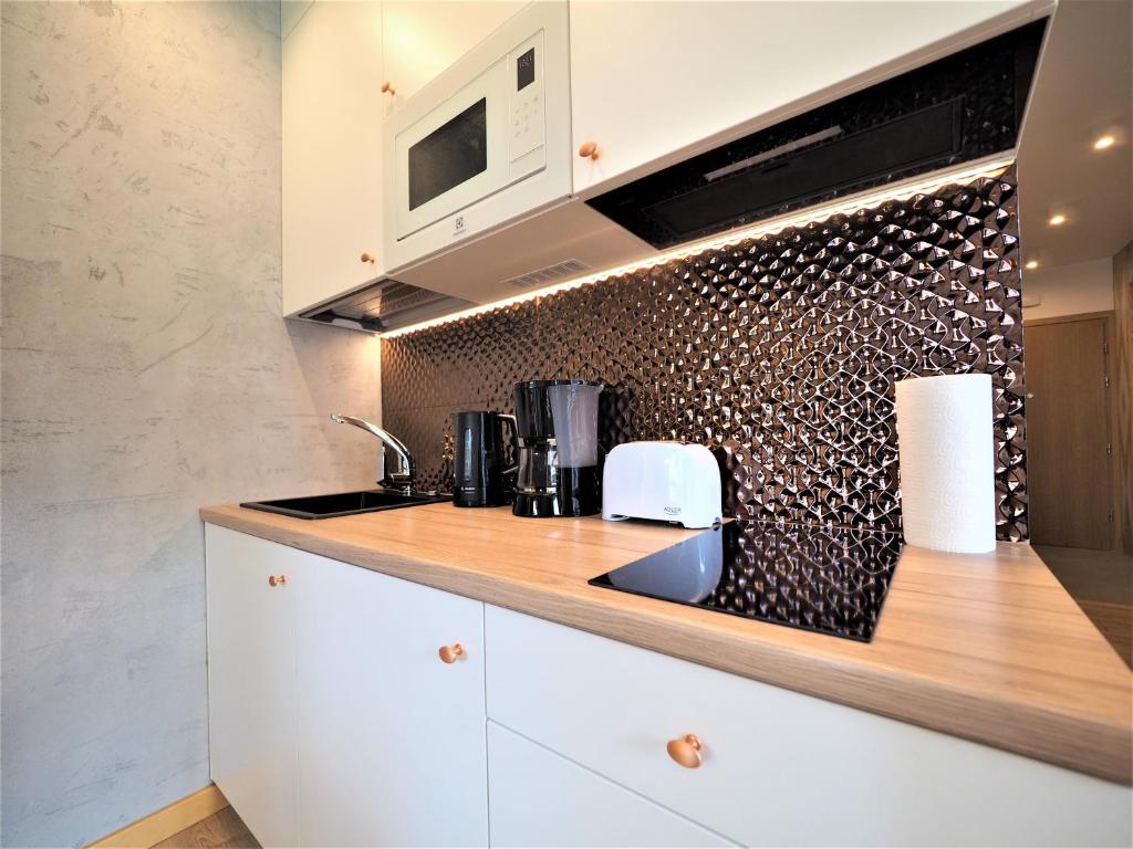 Kuchyňa alebo kuchynka v ubytovaní VIP Apartamenty VILLA MODERN