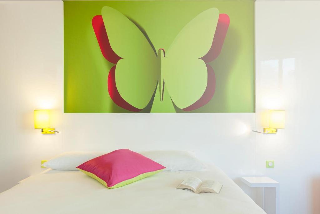 Postel nebo postele na pokoji v ubytování ibis Styles Bordeaux Saint Médard