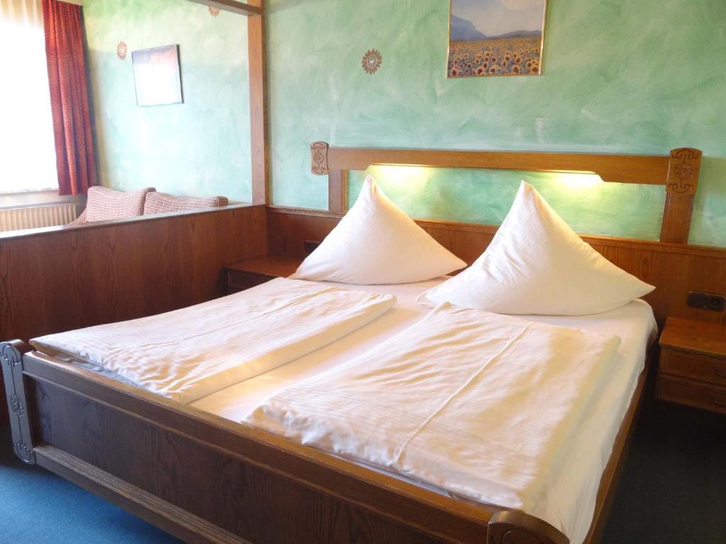 Postel nebo postele na pokoji v ubytování Beim Haxenwirt