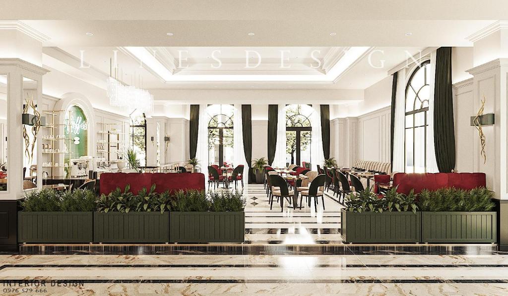 a restaurant with tables and chairs in a building at Thiên Ân Hotel Bắc Giang in Bắc Giang