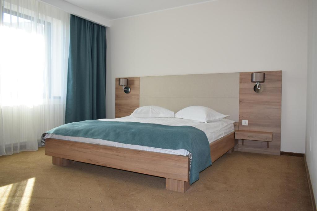 Postel nebo postele na pokoji v ubytování Hotel Regal