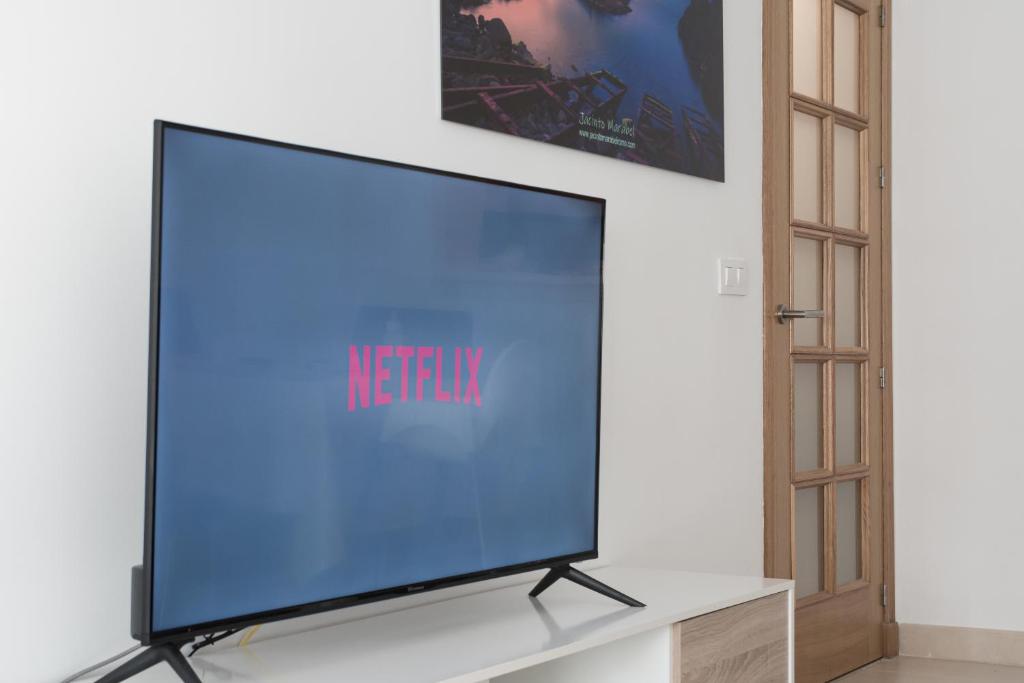 A television and/or entertainment centre at Casa Elena - Cabo de Gata