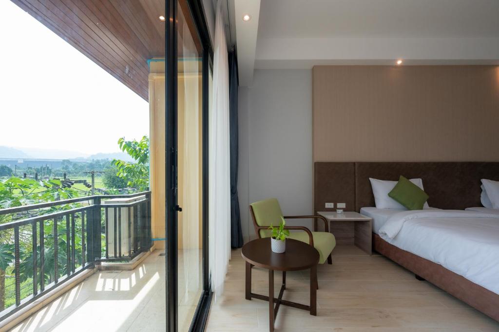 Postel nebo postele na pokoji v ubytování Phumontra Resort Nakhon Nayok