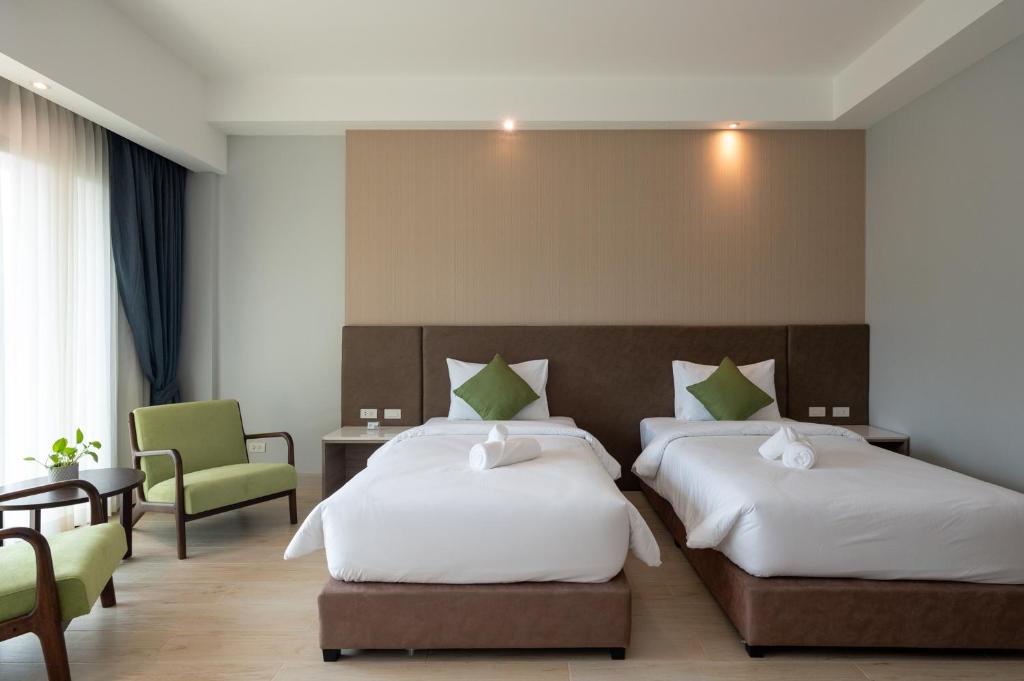 Postel nebo postele na pokoji v ubytování Phumontra Resort Nakhon Nayok