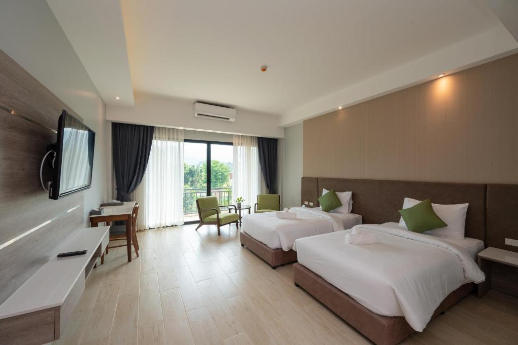 Postel nebo postele na pokoji v ubytování Phumontra Resort Nakhon Nayok