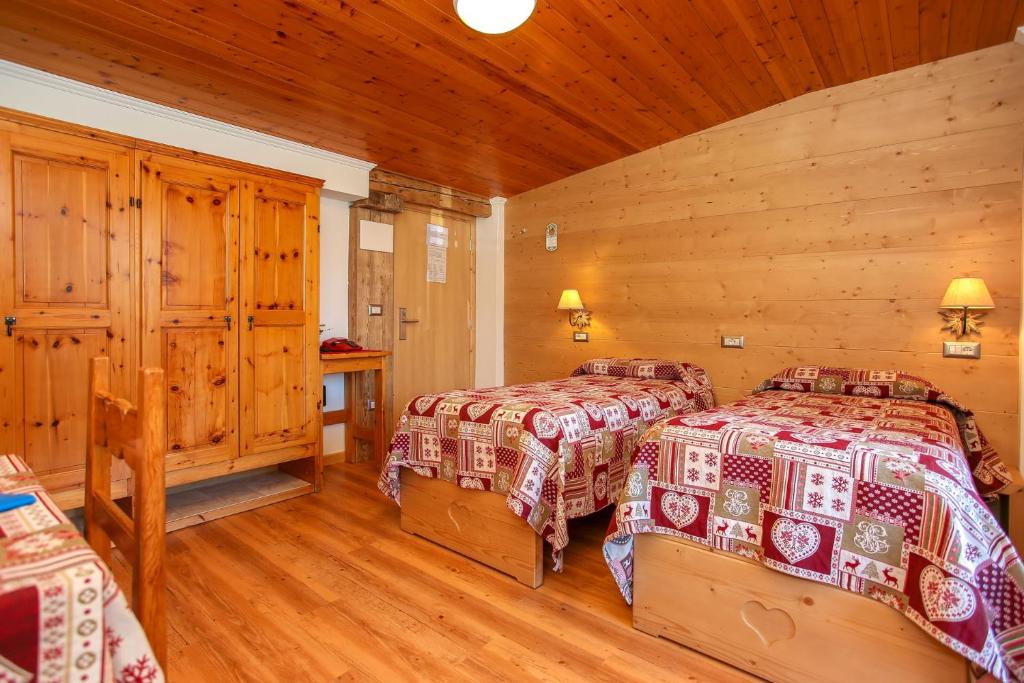 Postel nebo postele na pokoji v ubytování Albergo Adele