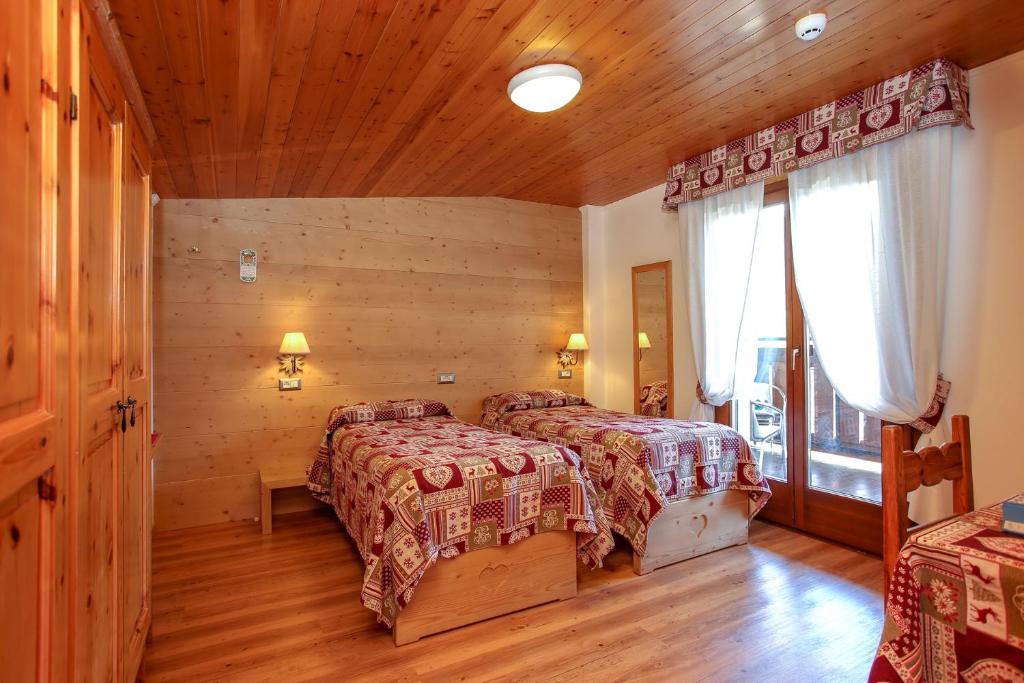 Postel nebo postele na pokoji v ubytování Albergo Adele