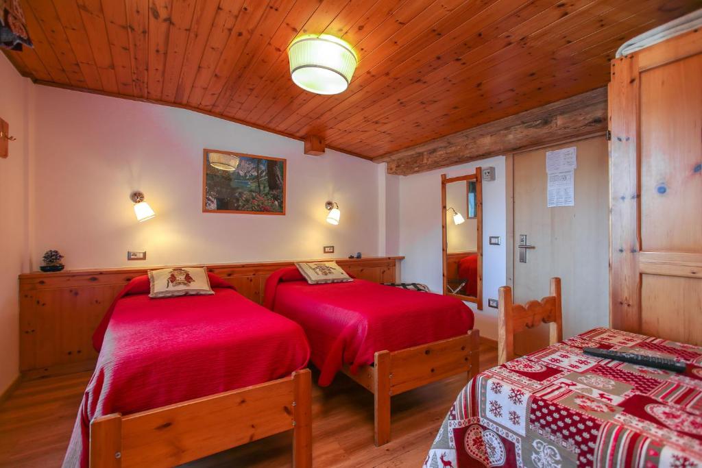 Postel nebo postele na pokoji v ubytování Albergo Adele