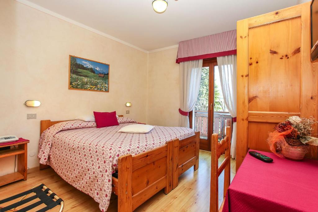 Postel nebo postele na pokoji v ubytování Albergo Adele