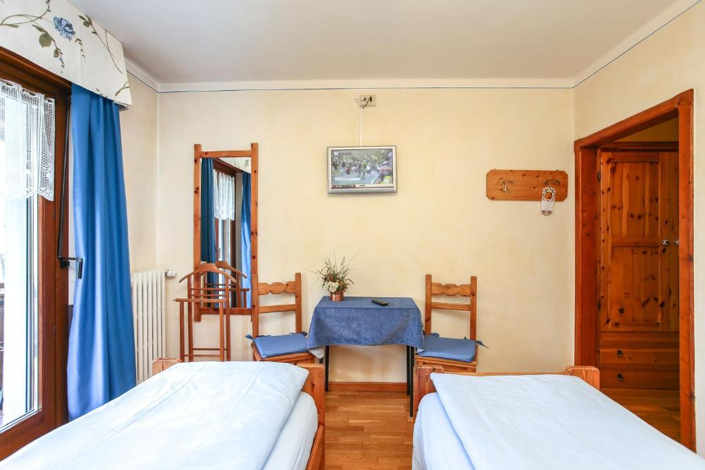 Postel nebo postele na pokoji v ubytování Albergo Adele