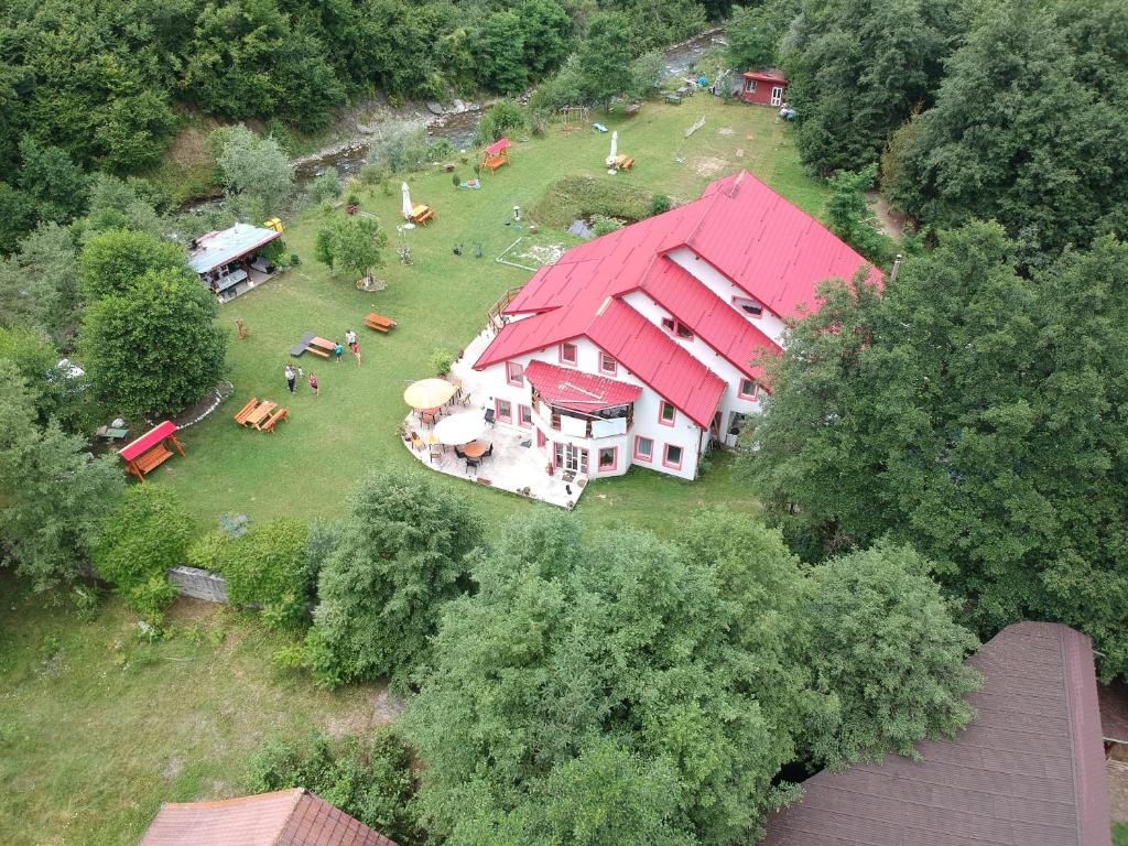 an aerial view of a large house with a red roof at Horia in Avrig