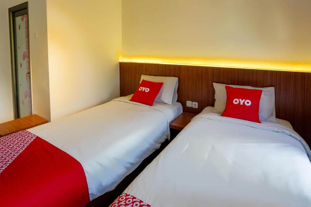 Postel nebo postele na pokoji v ubytování SUPER OYO 3109 Point Inn