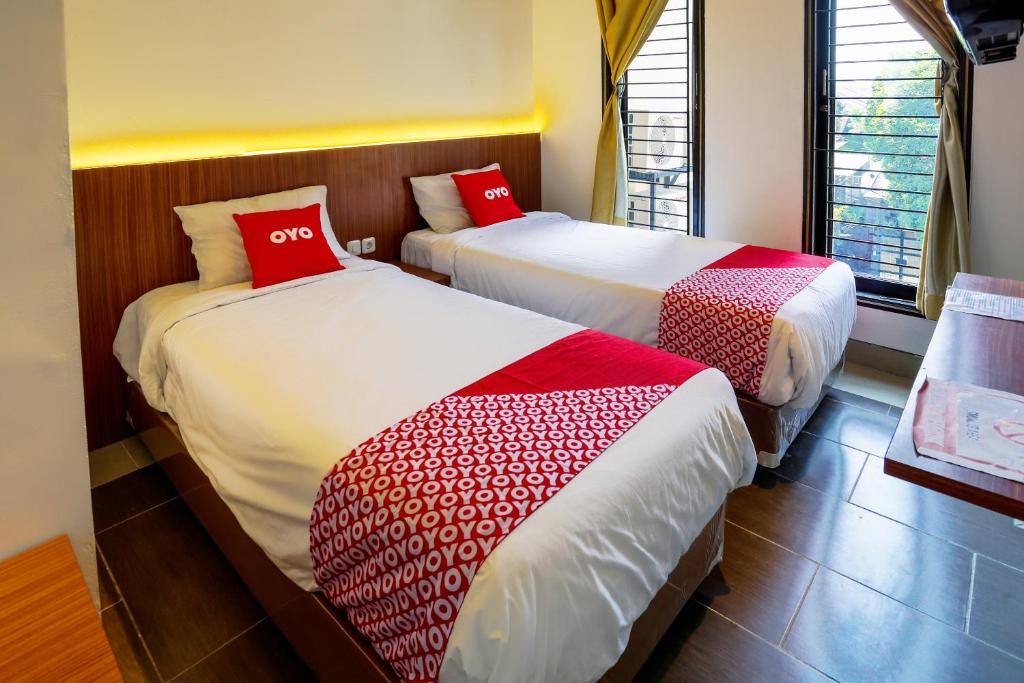 Postel nebo postele na pokoji v ubytování SUPER OYO 3109 Point Inn