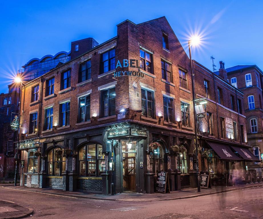 a large brick building on the corner of a street at Abel Heywood Boutique Hotel in Manchester