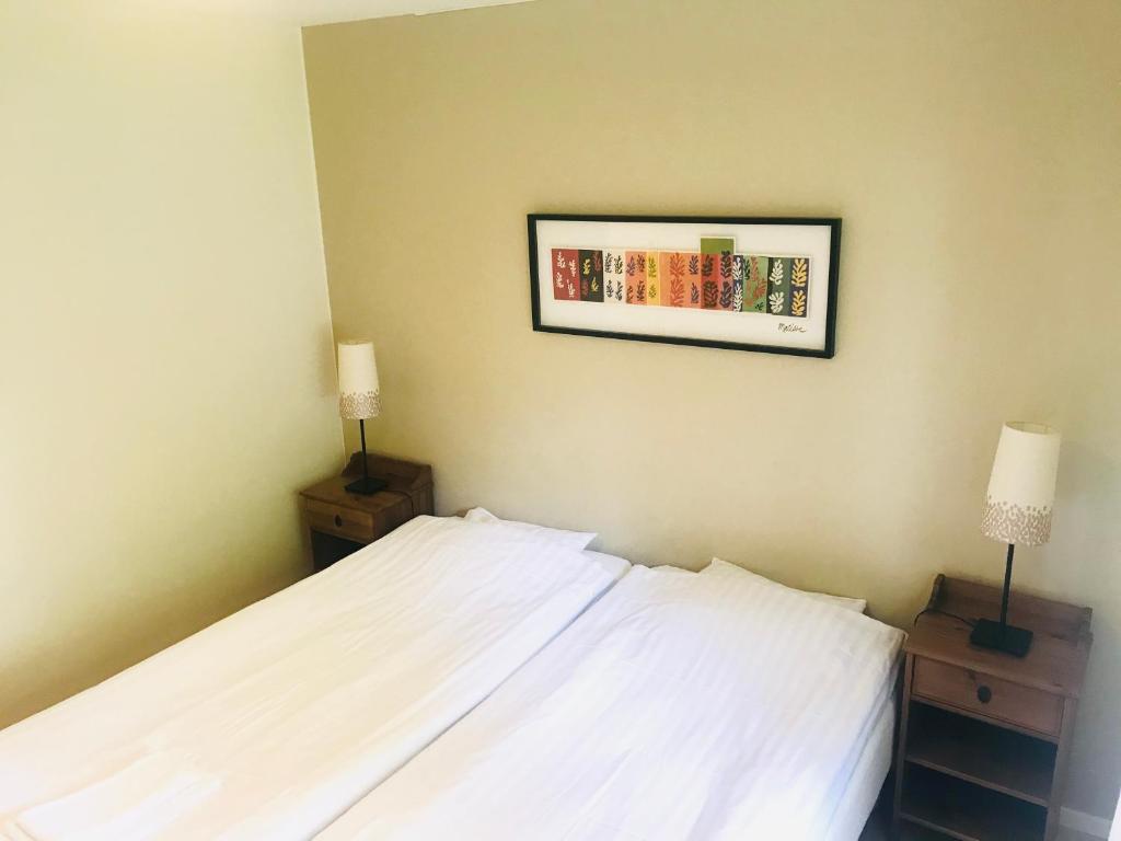 Postel nebo postele na pokoji v ubytování Wisingsö Hotell