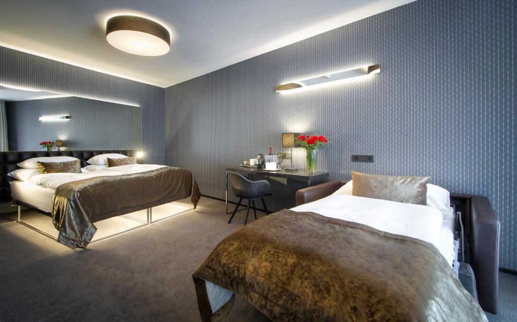 Postel nebo postele na pokoji v ubytování Hotel Mucha