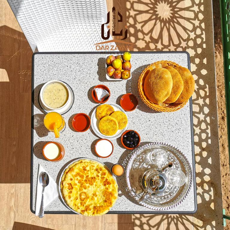 a table with eggs and other food on it at Dar Zayane in Khenifra