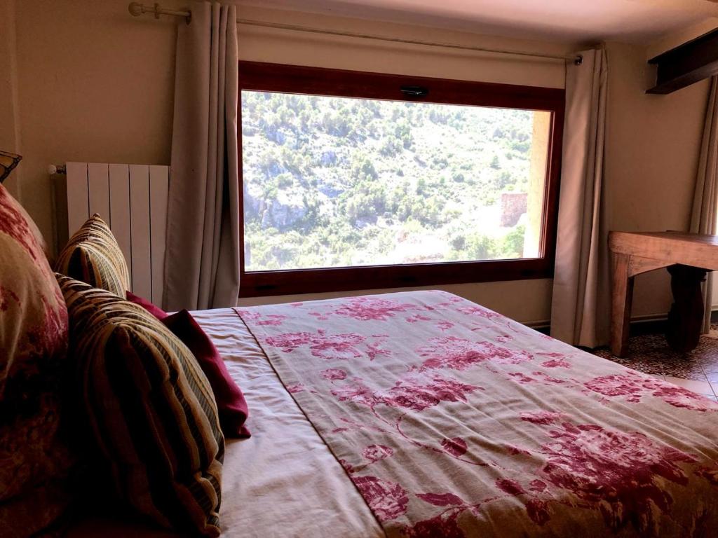 Postel nebo postele na pokoji v ubytování Cal Tató