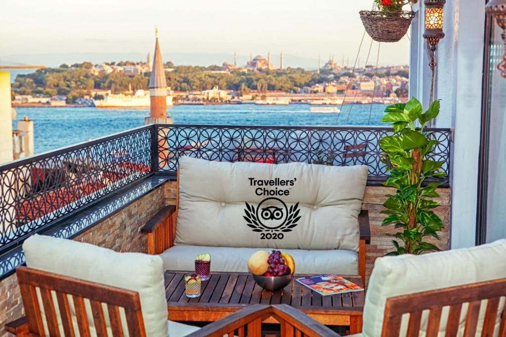a balcony with a couch and a table at MySuite Istanbul Cihangir in Istanbul