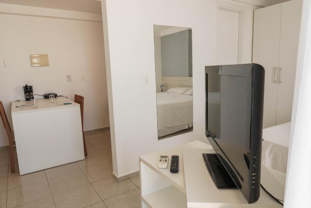  Confortável suíte integrada com vista mar em Natal por Carpediem