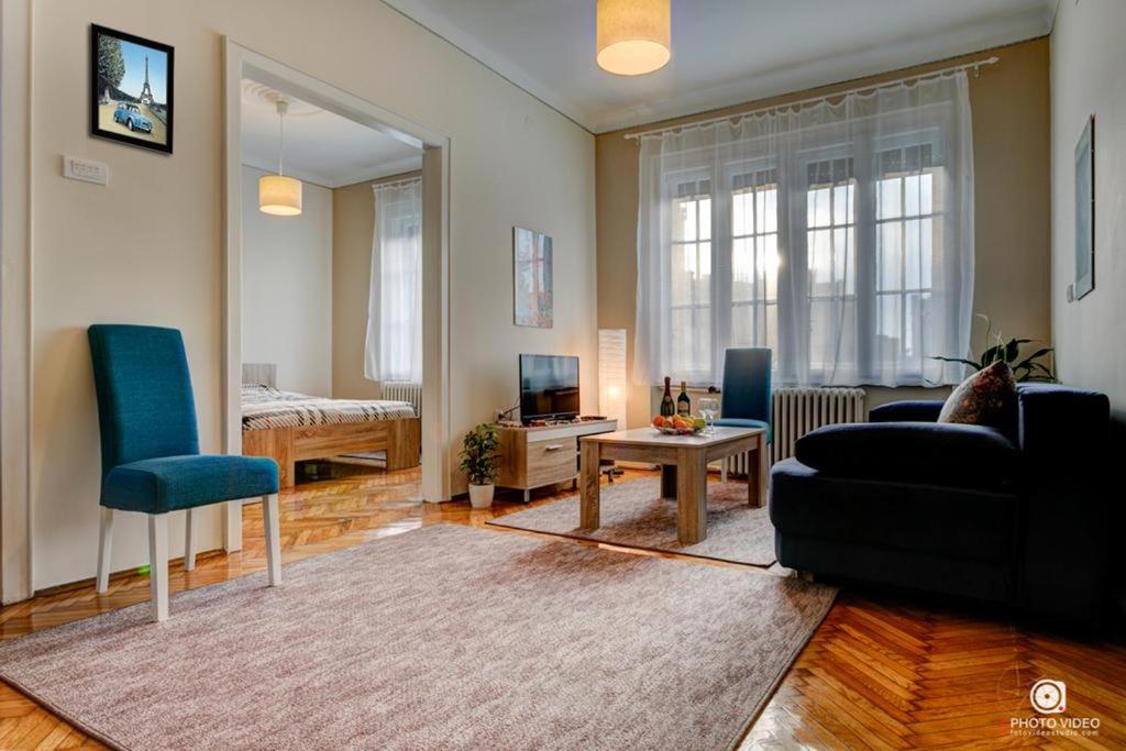 a living room with a couch and a table at Apartman Tara in Belgrade