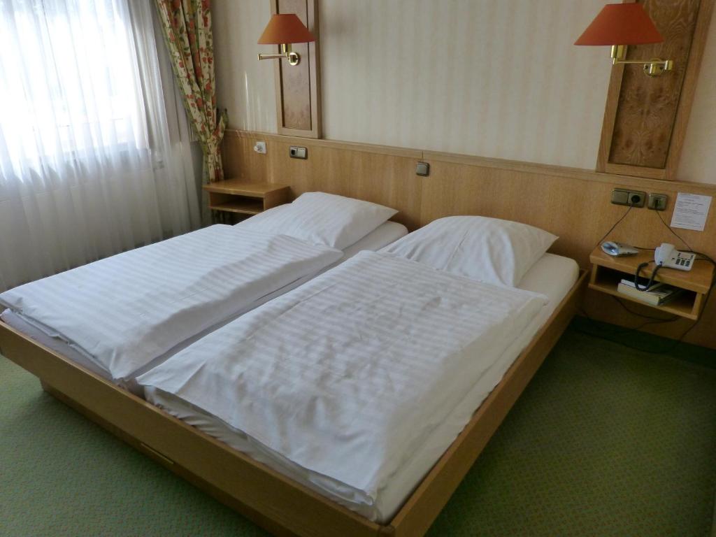 Postel nebo postele na pokoji v ubytování Schaperkrug