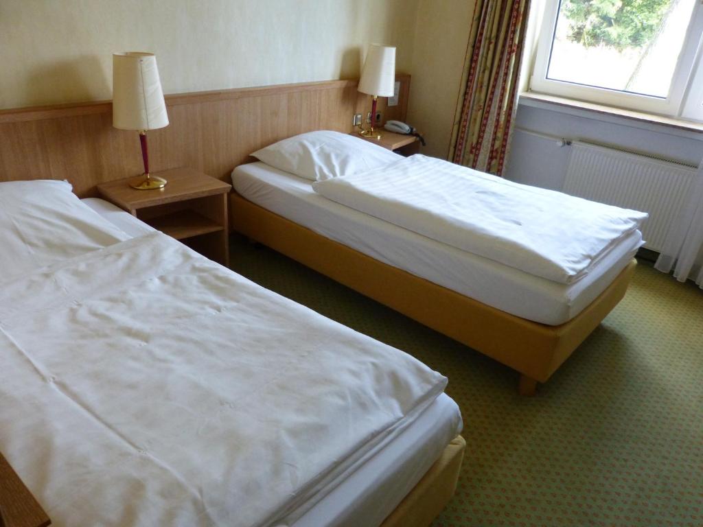 Postel nebo postele na pokoji v ubytování Schaperkrug