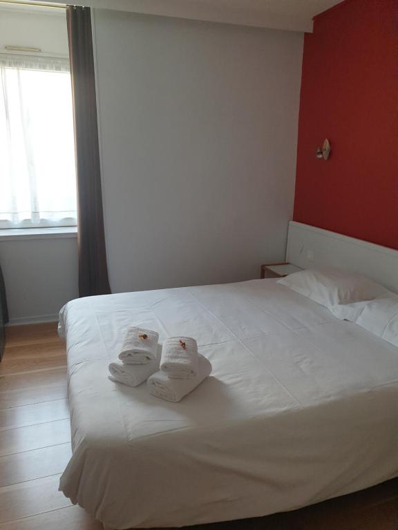 Postel nebo postele na pokoji v ubytování Hôtel Hermance