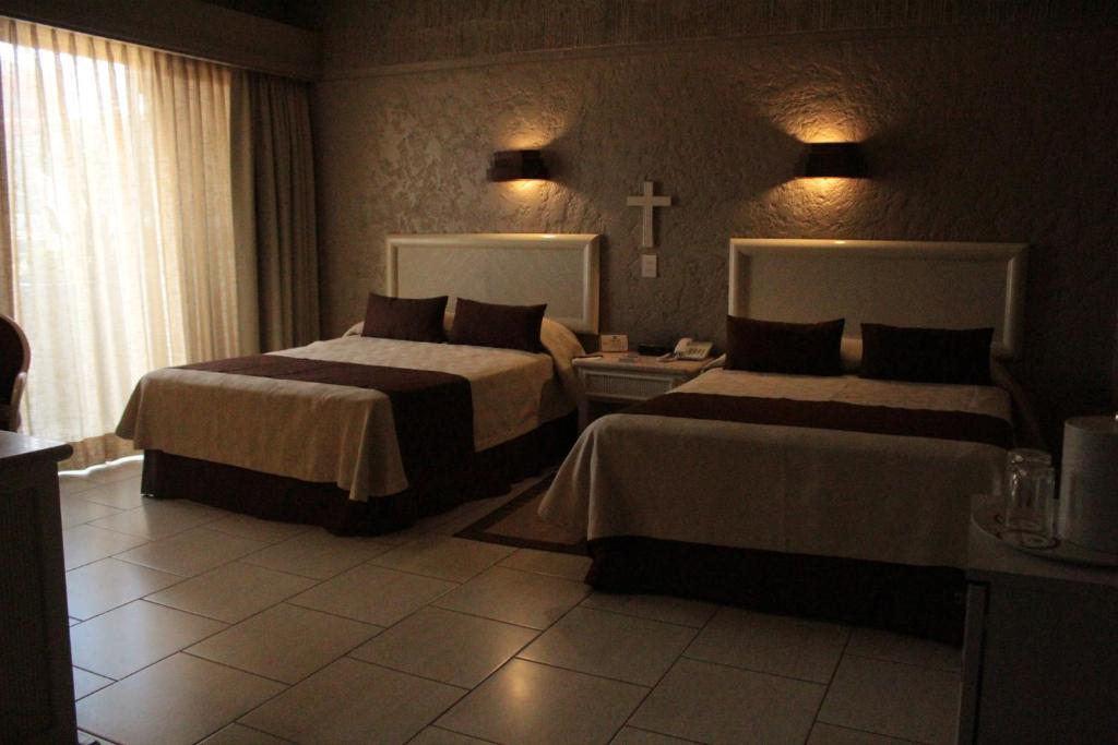 Postel nebo postele na pokoji v ubytování Hotel Layfer del Centro, Córdoba, Ver