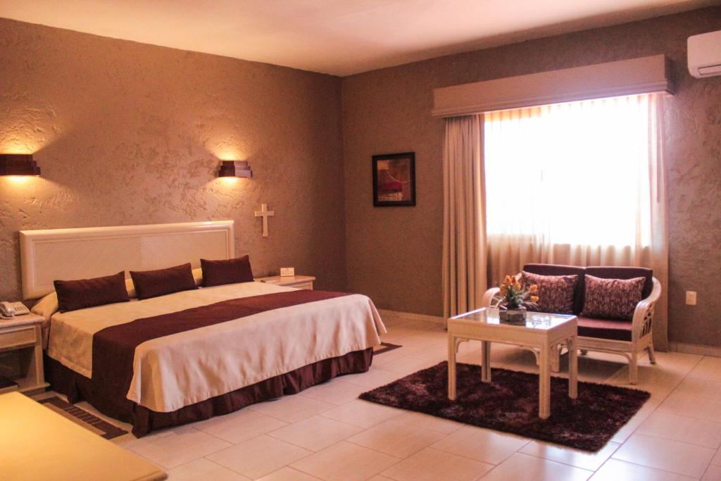 Postel nebo postele na pokoji v ubytování Hotel Layfer del Centro, Córdoba, Ver