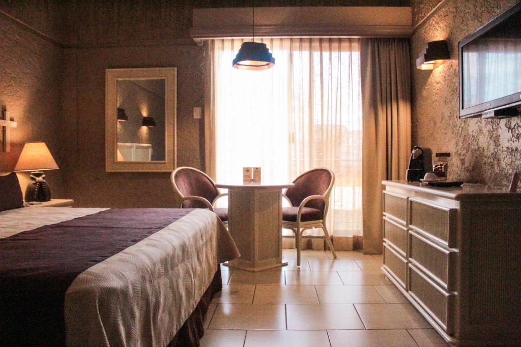 Postel nebo postele na pokoji v ubytování Hotel Layfer del Centro, Córdoba, Ver