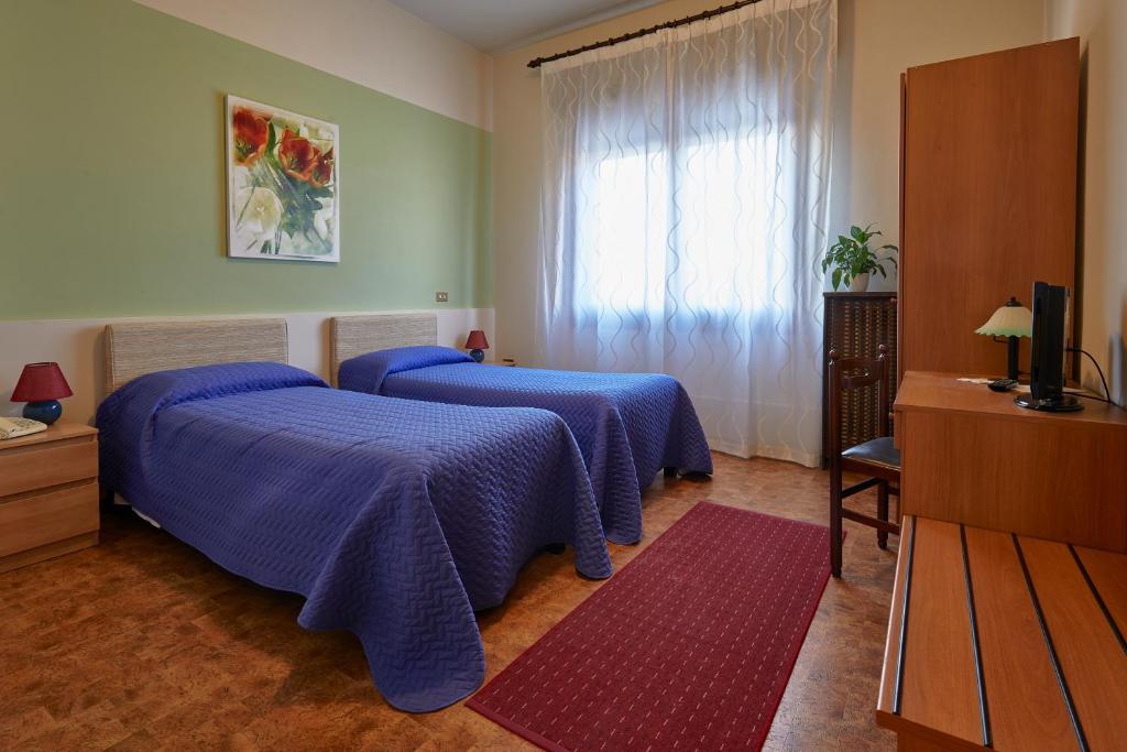 Postel nebo postele na pokoji v ubytování ALBERGO EUROPA