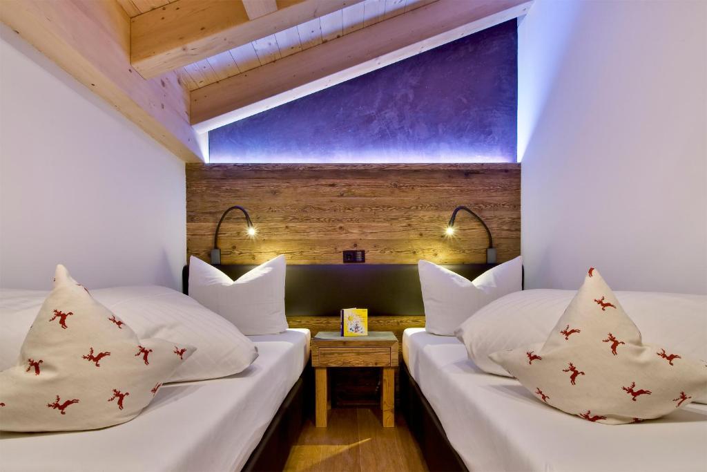 Postel nebo postele na pokoji v ubytování PETE Alpine Boutique Hotel - klein und fein - Private SPA Suiten und Zimmer