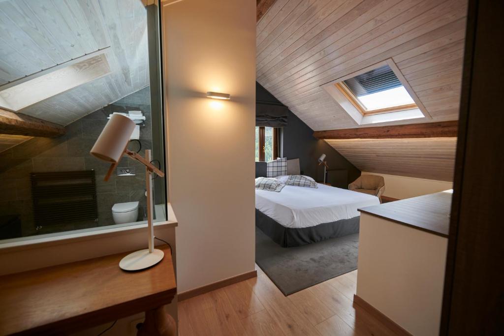 Postel nebo postele na pokoji v ubytování Hostal Lola